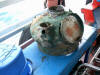brass compass binnacle on board after the dive prior to restoration. very heavy. as big as a 14 inch tv set. glass still in place after 80 years